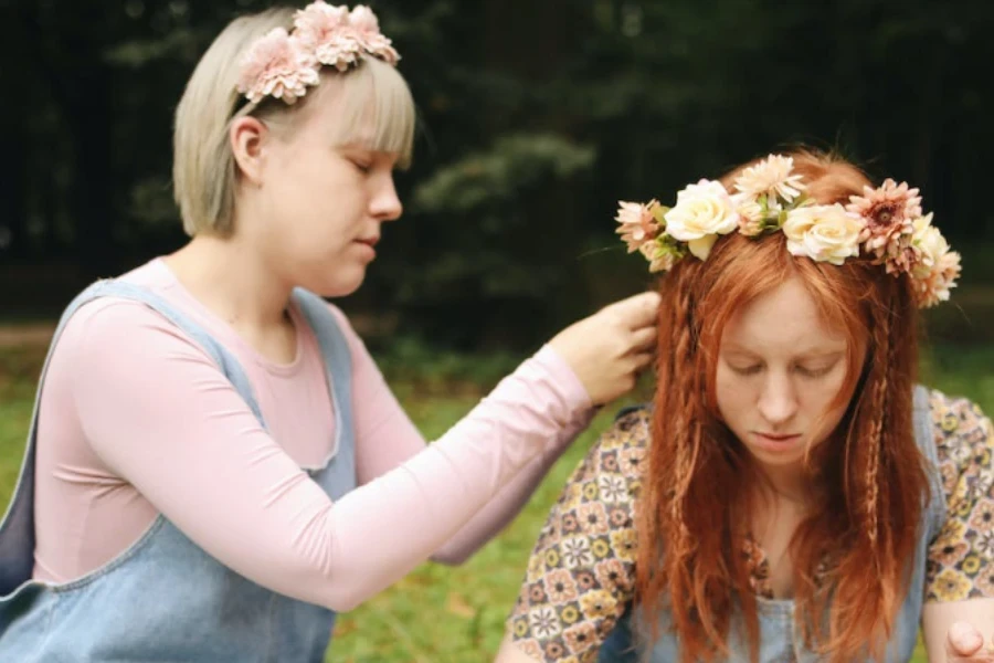 a-lady-wearinga-headband-on-her-friends-head