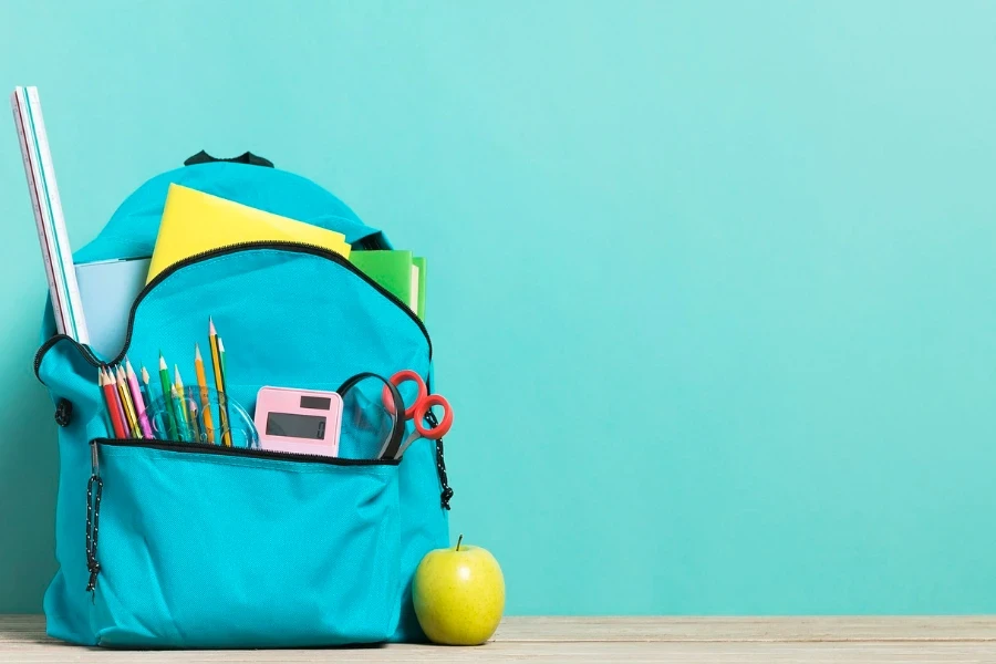 A blue schoolbag full of stationery