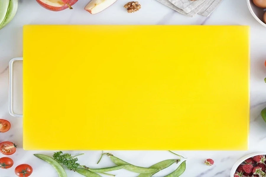 A yellow flexible cutting board