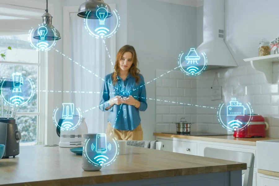 Person using smartphone in the kitchen to control home automation