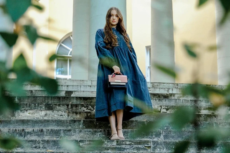 Woman in a blue flowy, voluminous gown