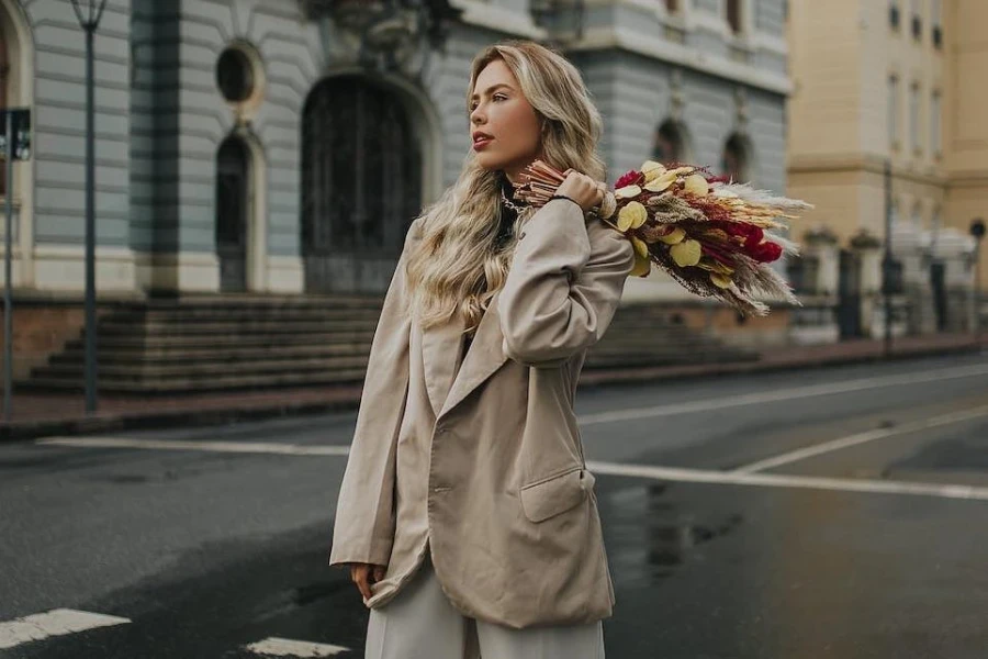 Woman wearing a sand-colored oversized coat