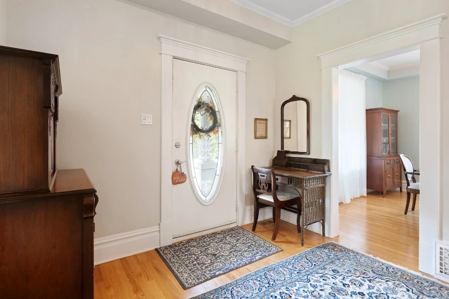 Wood and wicker entrance table used as a desk