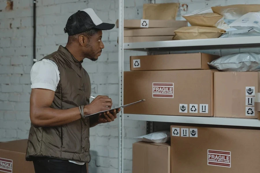 Man checking different delivery boxes