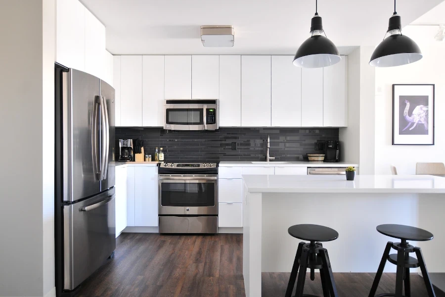 White kitchen with black swivel bar stools