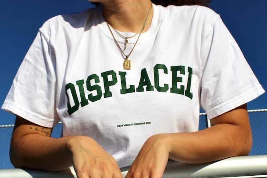 The girl wearing a white T-shirt with English letters