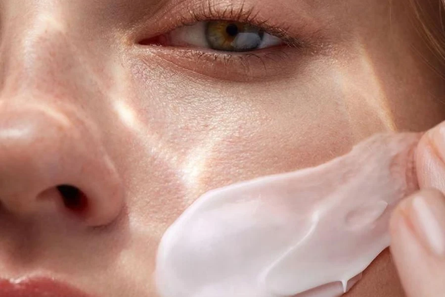 a woman applying cream