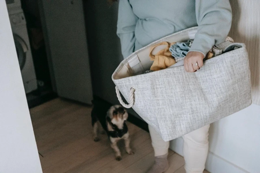 A woman carrying a cloth laundry bag