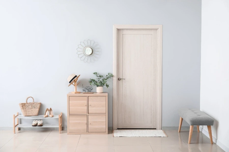 bench, shoe rack and other decor items in an entryway