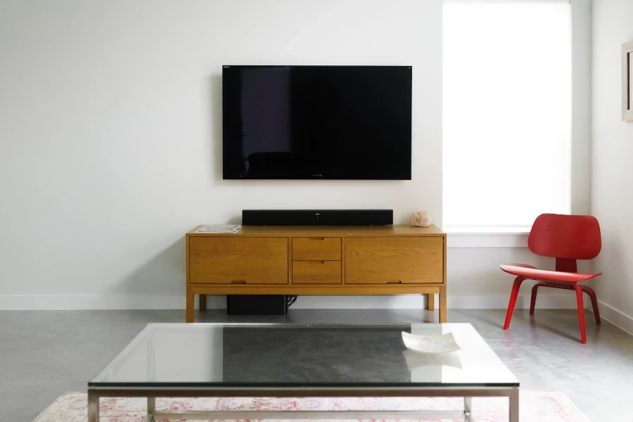 Living room with red armless accent chair