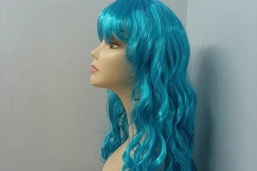 Shiny blue synthetic hair wig on a mannequin