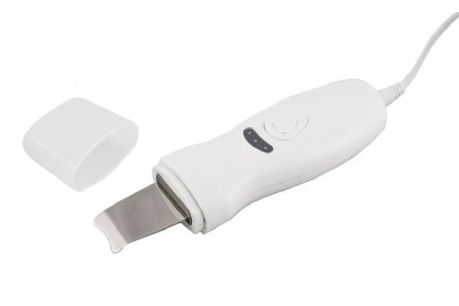 White handheld ultrasonic skin scrubber on white background