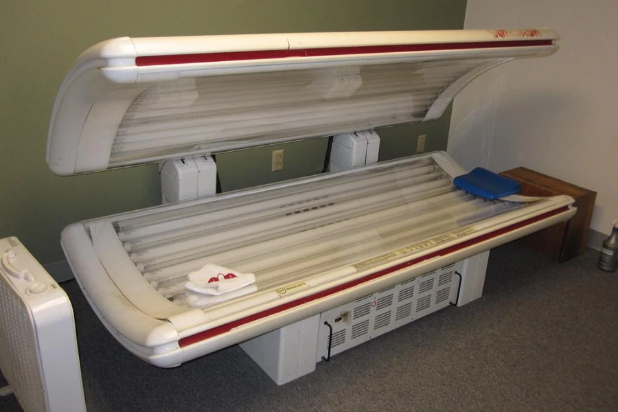 A white tanning bed with red lining
