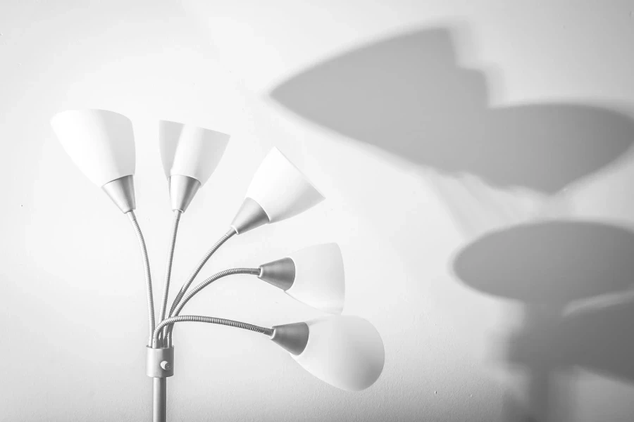 A white tree floor lamp in a room