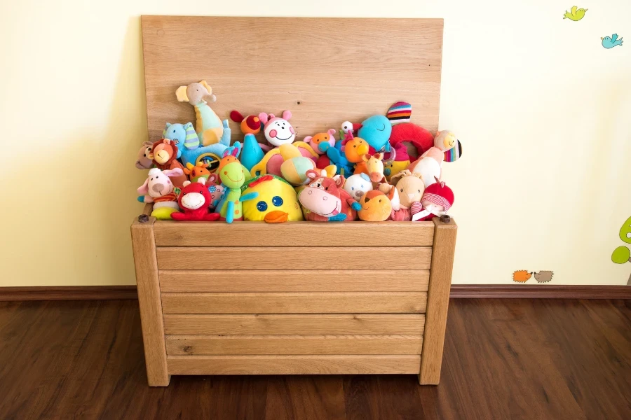 A wooden box full of soft toys