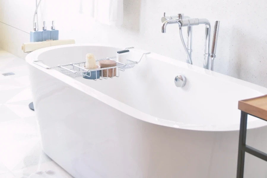 Oval bathtub with chrome metal bath tray