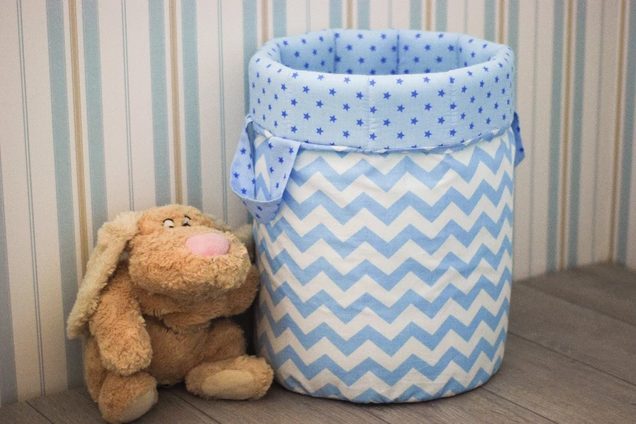 Toy storage basket with a teddy bear