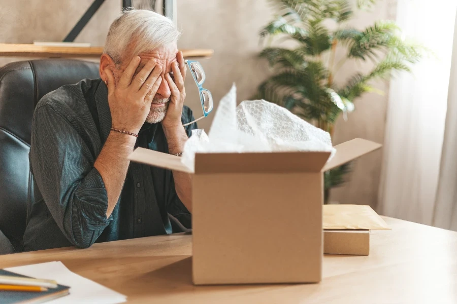 Upset man closes eyes before returning goods to the store