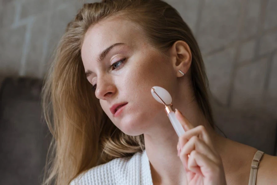 Lady using a derma roller on her face