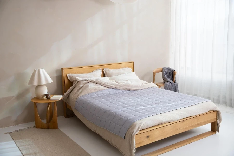 A brown duvet cover under a gray bed cover