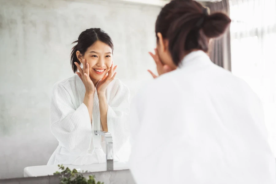 A woman cleaning her face