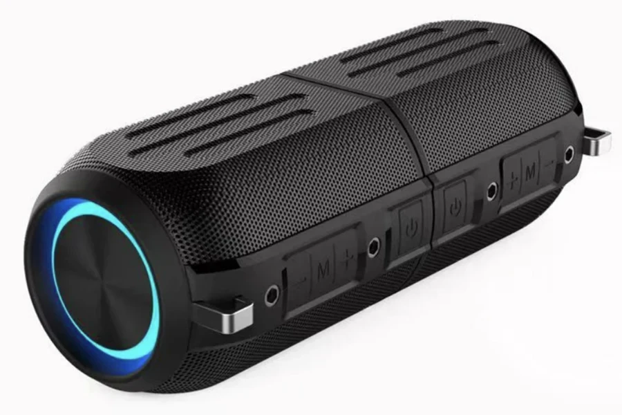 Speaker tahan air berbentuk silinder hitam dengan LED biru