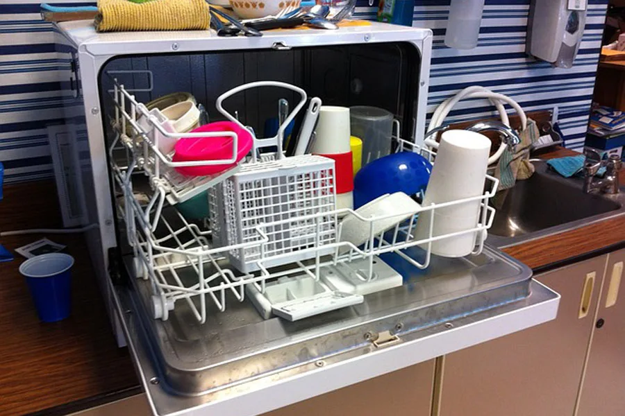 A portable dishwasher in a small kitchen