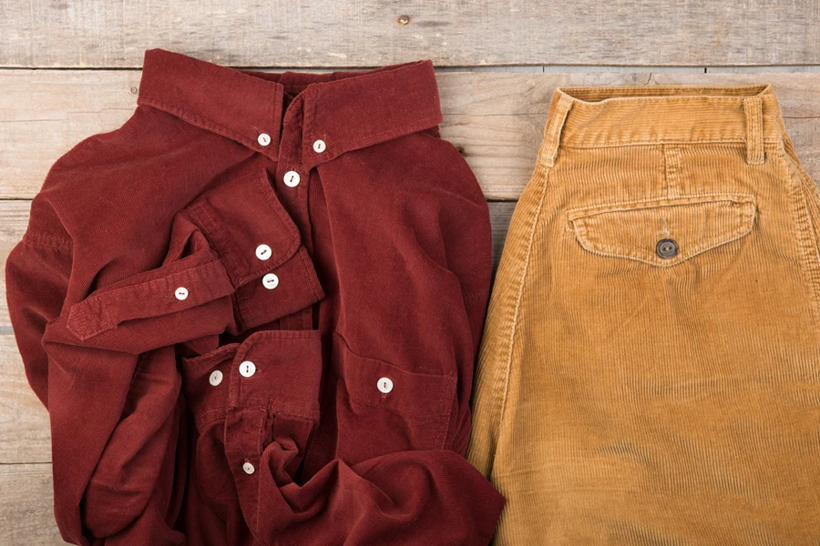 A red shirt with a brown corduroy skirt