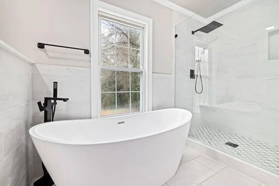 A white freestanding bathtub in a bathroom