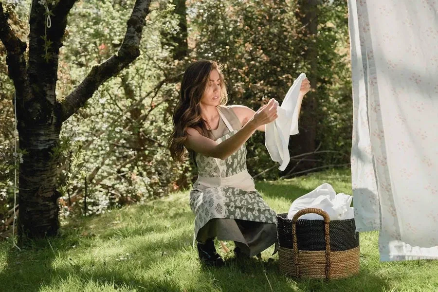 A woman using a stylish laundry basket