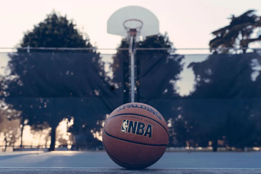 An NBA Spalding basketball on a basketball court