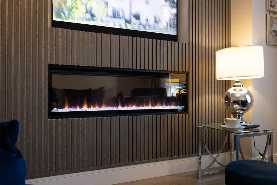 An art décor lamp next to a modern fireplace