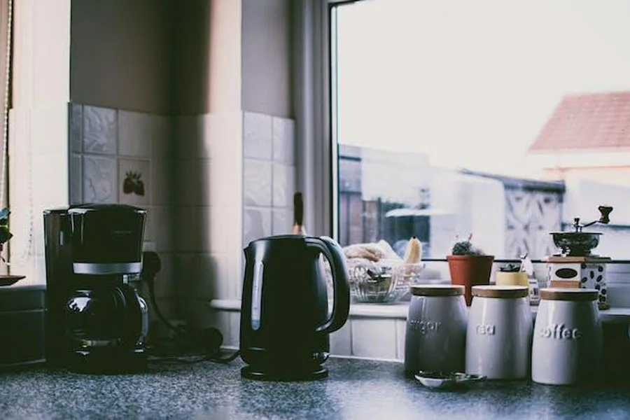 Black kitchen appliances on a kitchen countertop