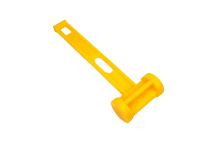 Bright yellow nylon camping mallet with holes in handle