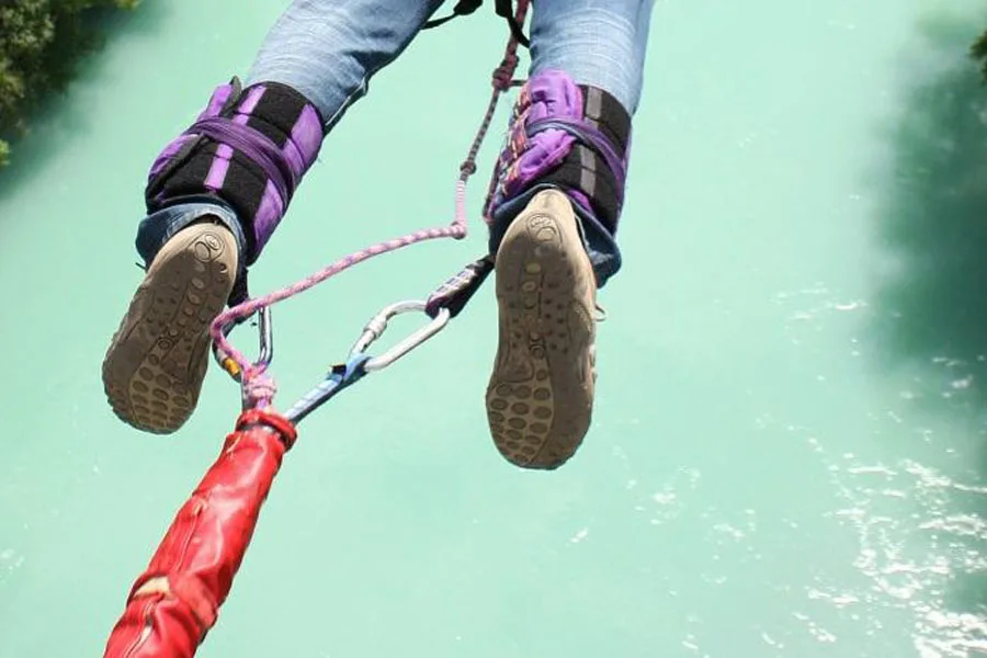 Bungee connectors attached to a jumper's ankle harness
