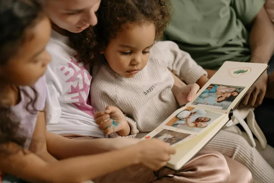 Family looking at a photo album together