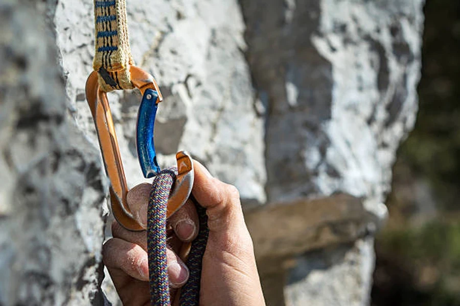 Non-locking carabiner being used to hold climbing rope