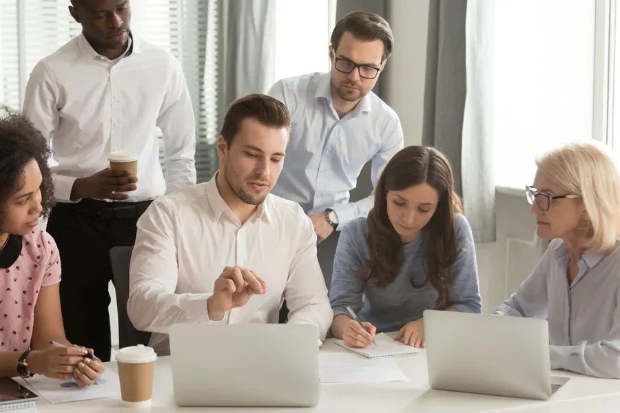 People gathering at a meeting brainstorming