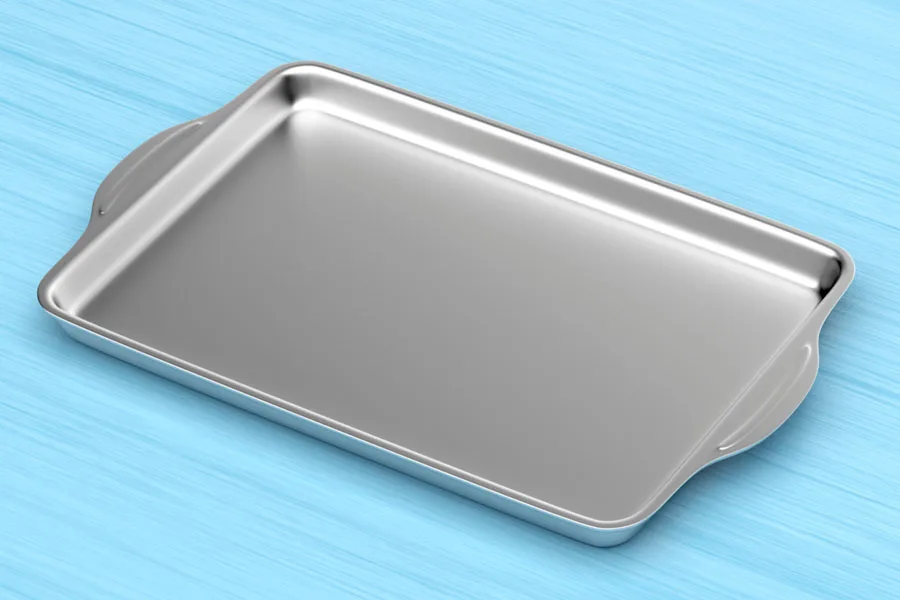 Silver aluminum rimmed baking sheet on a surface