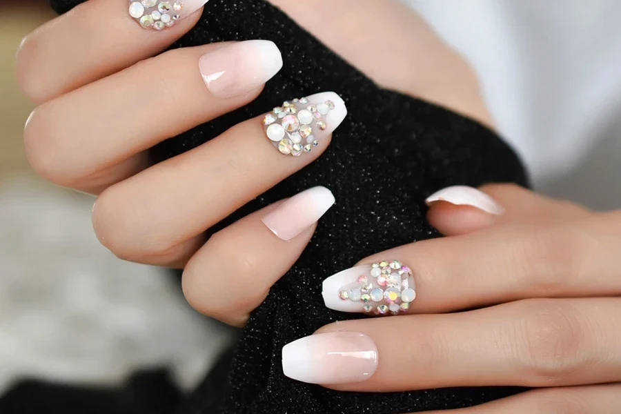 White nails with beautiful rhinestones