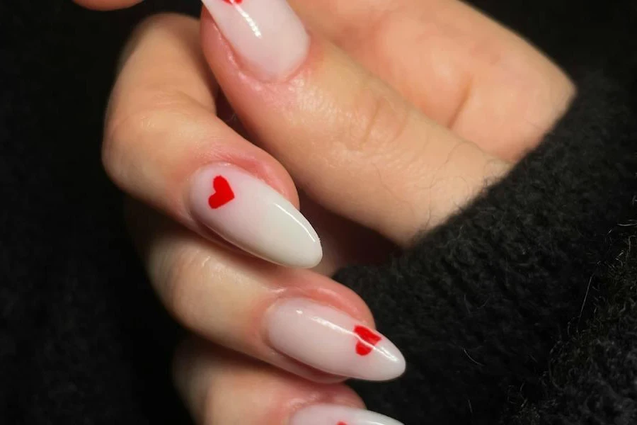 Woman showcasing artistic acrylic nails