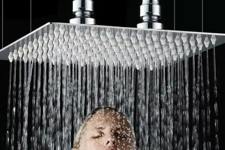 Woman under a 24-inch rain shower