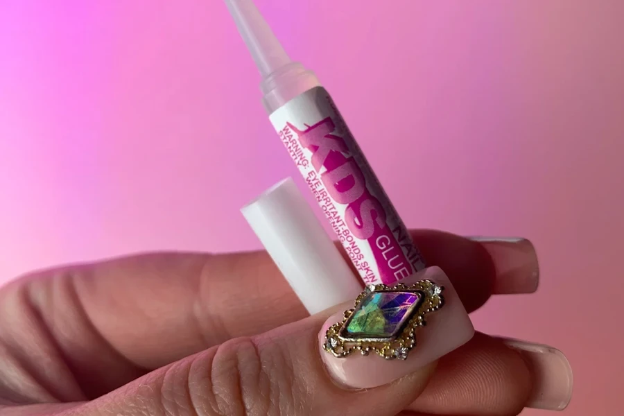 Woman with rhinestone showcasing nail glue