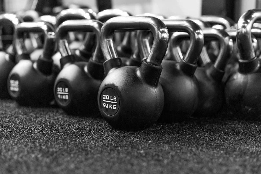 A black kettlebell variety pack on the floor