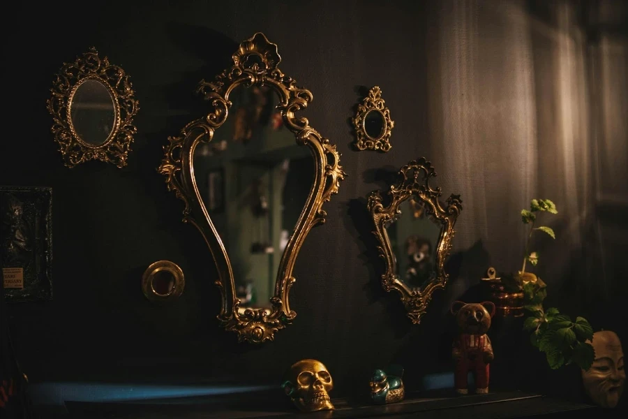 A couple of ornate mirrors on the wall