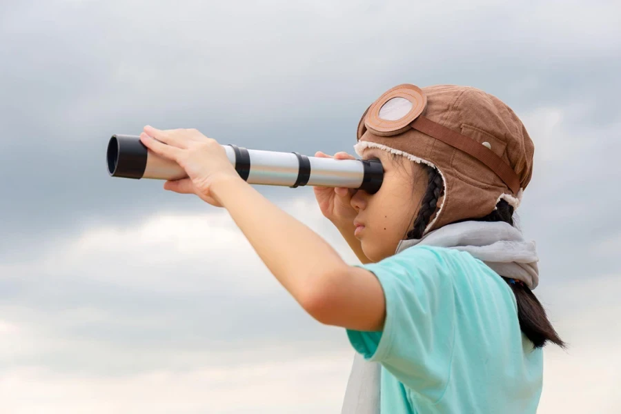 a girl using spyglass