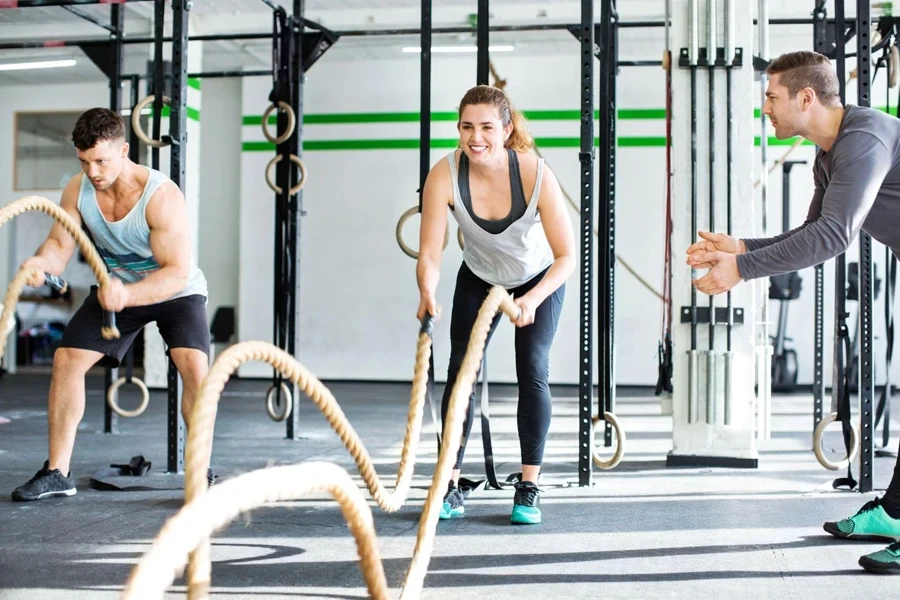 happily playing battle ropes