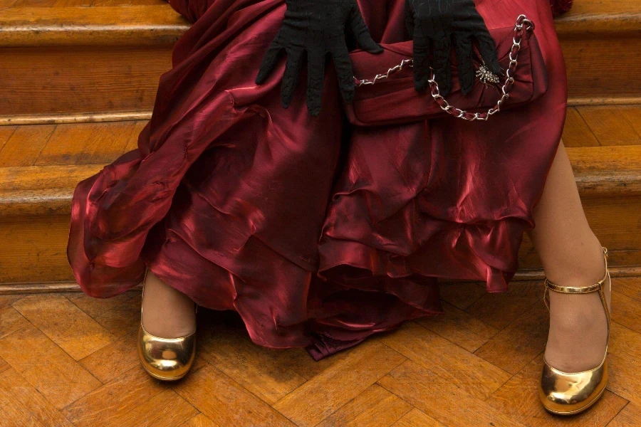 Sitting girl in red dress