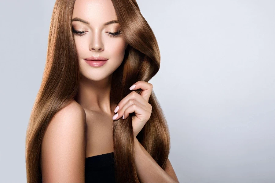 Young, brown haired woman with voluminous hair