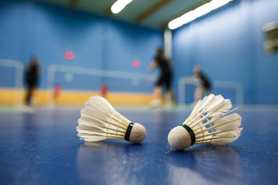 badminton courts with players competing